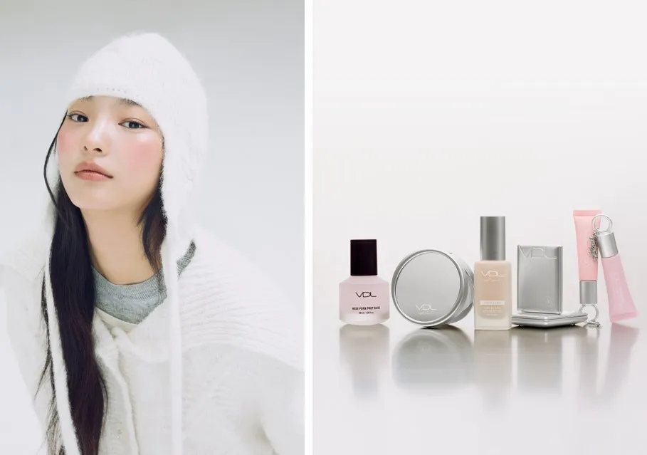 女性が白い帽子とセーターを着ており、VLDの化粧品が並んでいます。